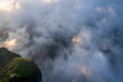 Mountaintop Farmhouse From Above the Clouds